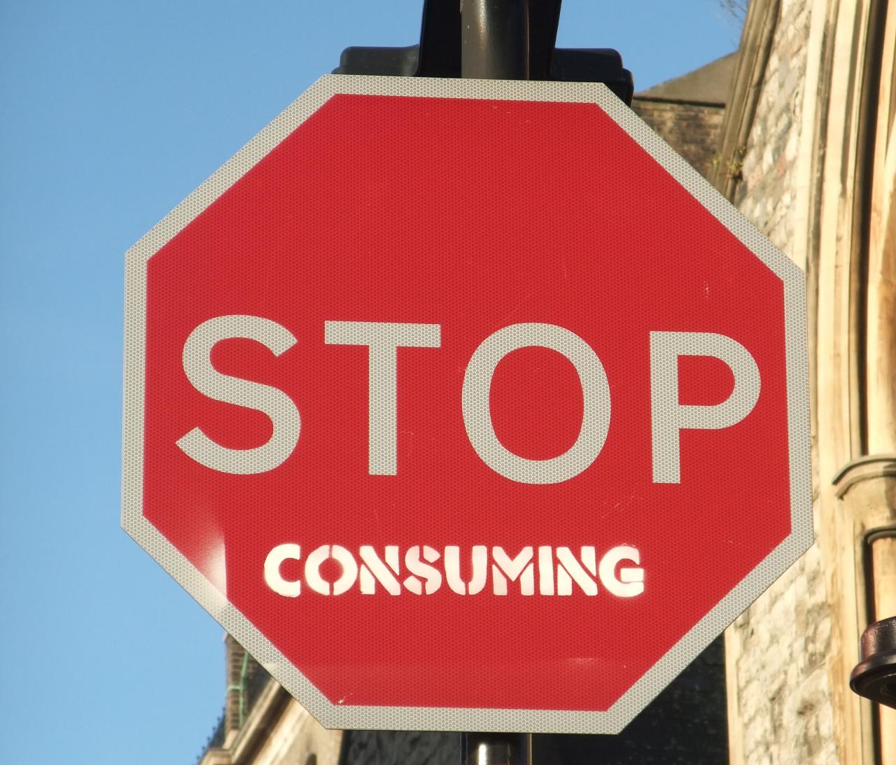Stop sign with the word 'consuming' added to it, so that it reads 'STOP consuming'