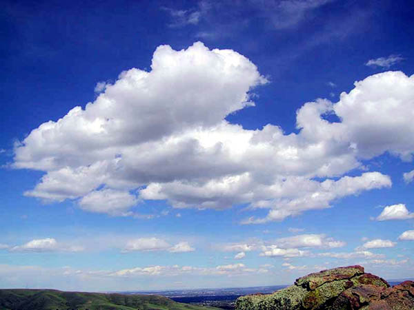 Photograph of cumulus clouds in a blue sky