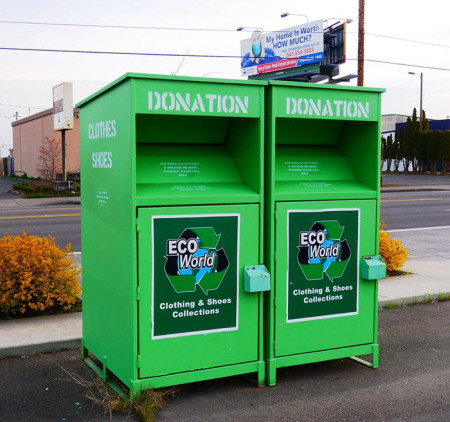 Two EcoWorld clothing and shoes collection donation boxes