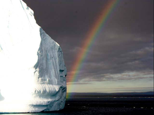 Rainbow and an icerberg, NE Greenland National Park