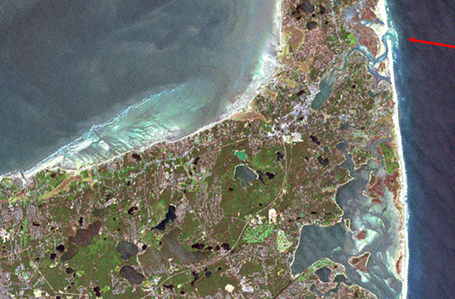 Satellite image of Cape Cod. Arrow in upper right points to inlet to Nauset marsh piercing the great barrier beach