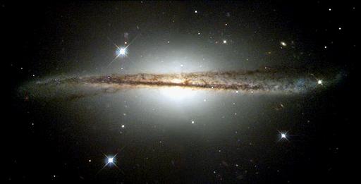 Photo from the Hubble telescope showing an edge-on galaxy