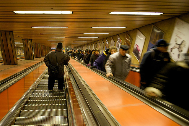 escalators going up and down with people riding