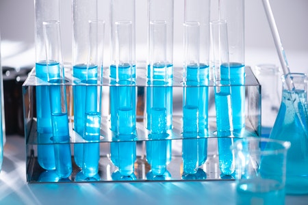 test tubes holding blue liquid, beakers in bottom right