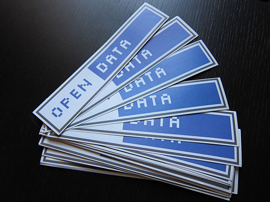 A fanned out stack of stickers that read Open Data