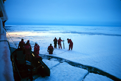 Researchers in the South Pole gathering ice core samples.