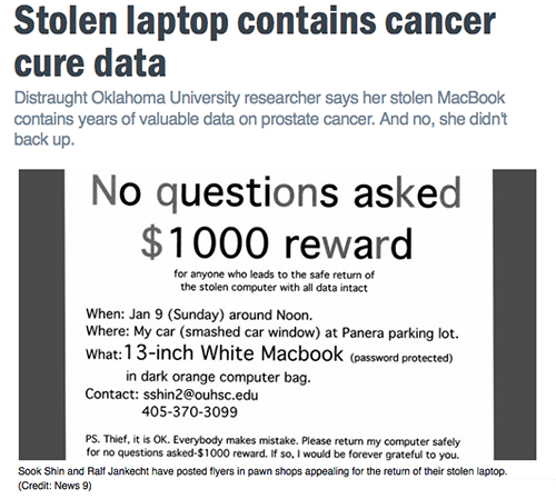 sign requesting return of stolen laptop - $1000 reward