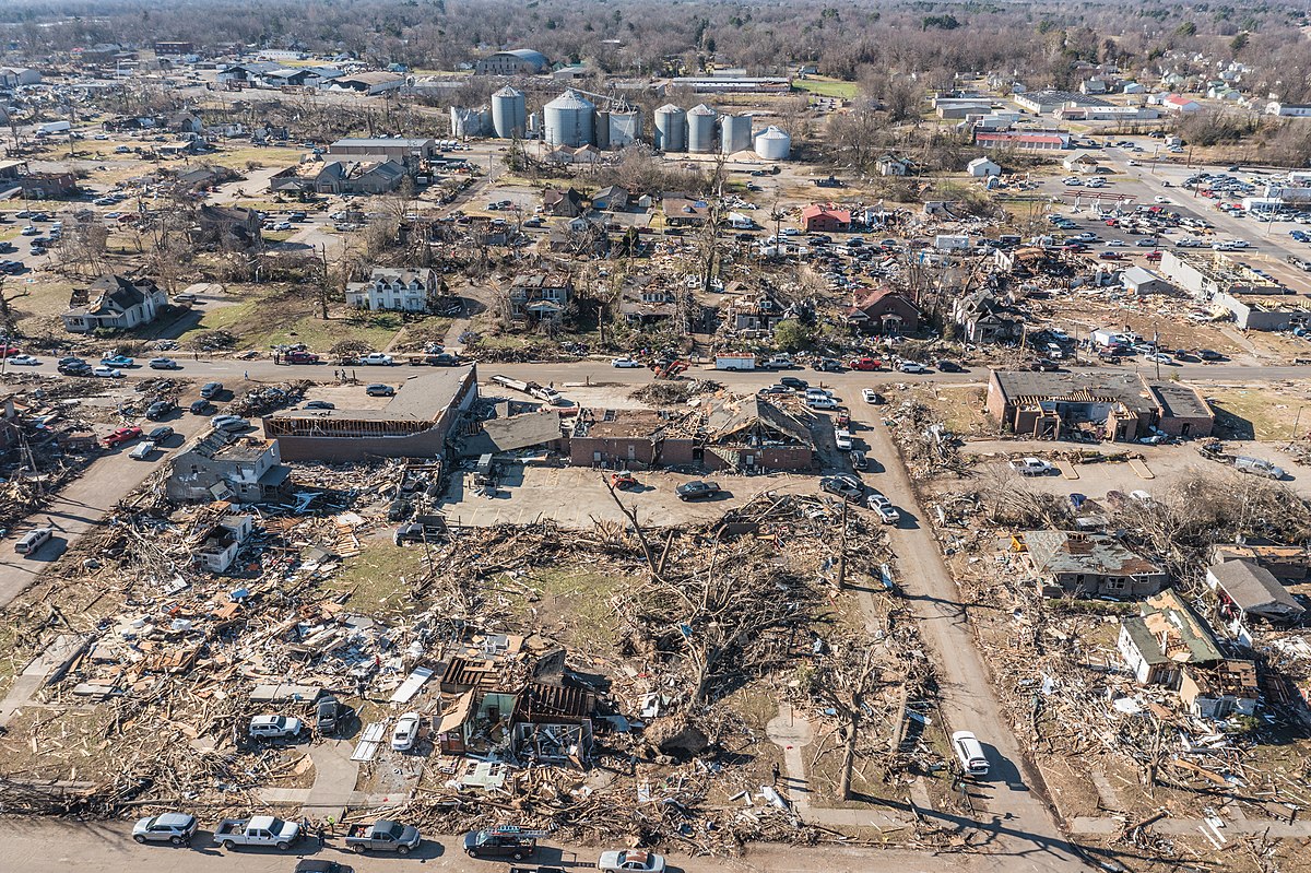Aerial view of destroyed buildings and landscape after Mayfield, KY tornado.