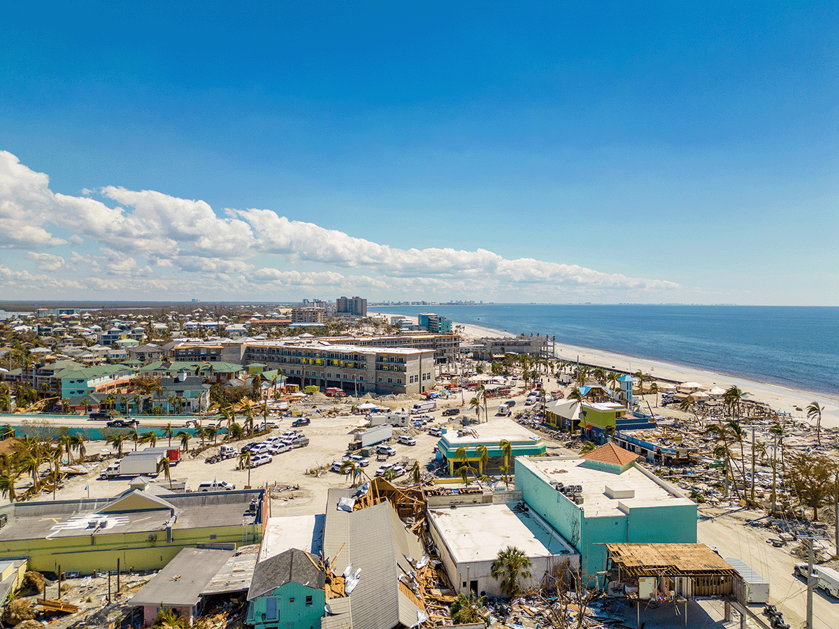 Damage from Maria on Puerto Rico. destroyed houses and trees stripped of their leaves