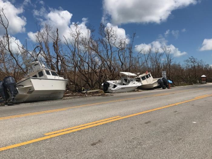 Damaged boats alongside the road