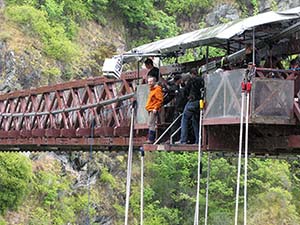 Dr. Alley standing on a bridge preparing to bungee jump.