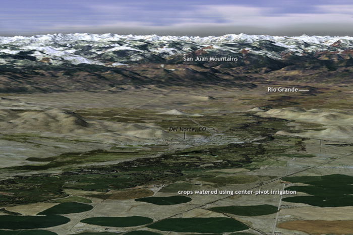  aerial perspective view of the Rio Grande River source terrain in the US & the agricultural irrigation (center pivot) in Colorado/New Mexico