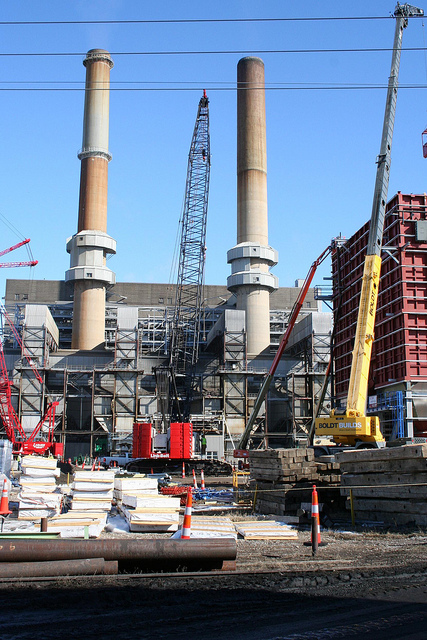 Outside of a power plant. Images shows Two tall skinny towers 