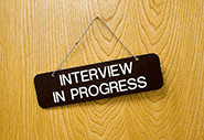  Door with sign that says interview in progress on it