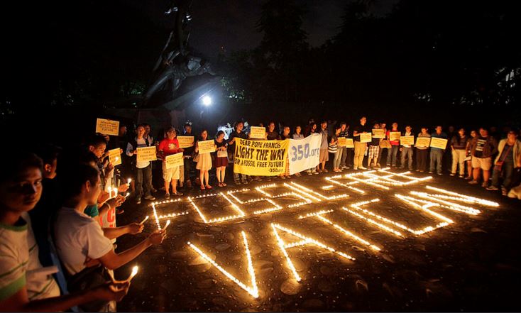 Protesters in the Philippines advocate for the divestment of fossil fuels by the Vatican Bank
