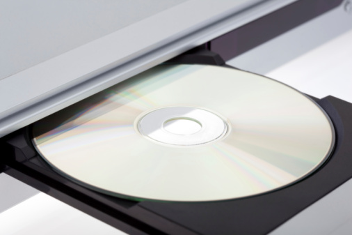 A blu-ray disc going into a player