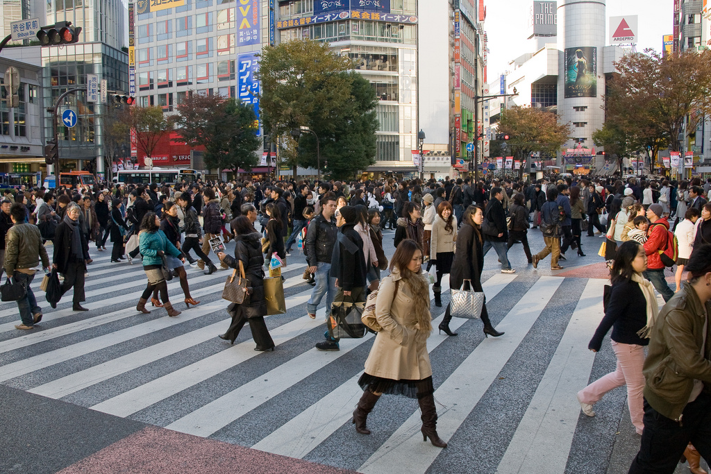 Photo of Shibuya Crossing. Hundred of people trying to cross at one intersection