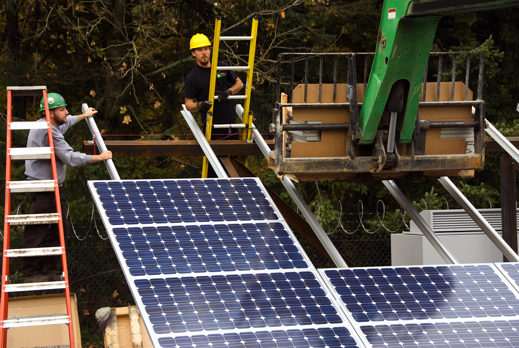 Professionals working on PV panels