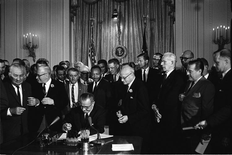 Picture showing Lyndon Johnson signing the Voting Rights Act of 1964.