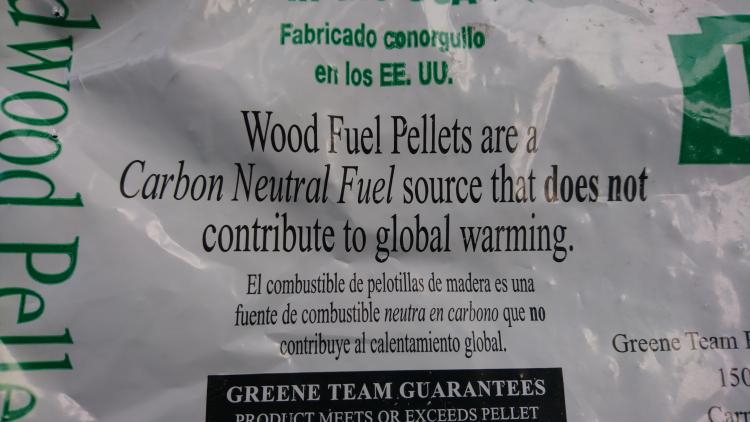 image of "carbon neutral" label on a bag of wood pellets
