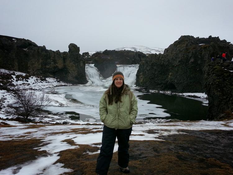 Haley Sankey stands in front of a waterfall in Iceland, in February of 2014