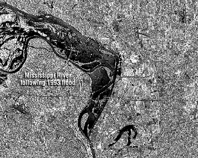 Areas inundated by flood of the Mississippi River in 1993. Water dark, surrounding land lighter/textured. More in text below. 