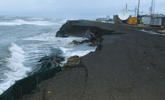 Coastal erosion with ocean wearing away road