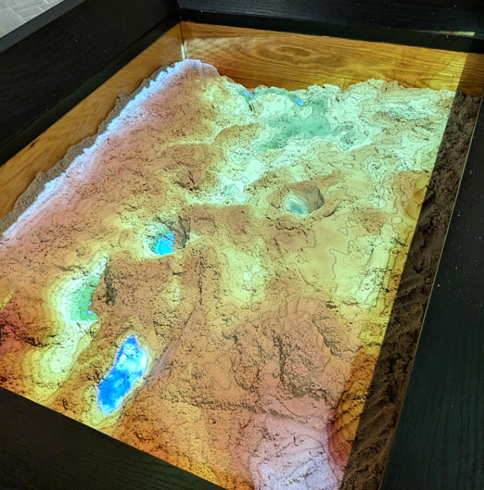 AR Sandbox at Penn State's EMS Museum - sandbox with colored light representing heights