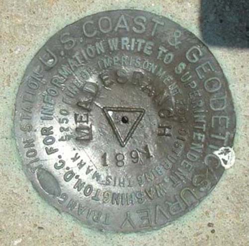 photo of the USGS datum marker at the monument at the Initial Point of NAD27