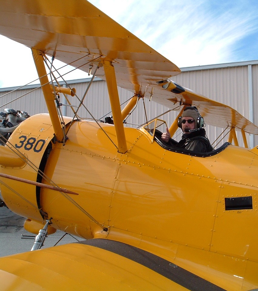 photo of Michael Tomas in the cocpit of an airplane