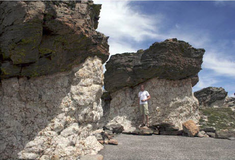 man standing in front of white granite.