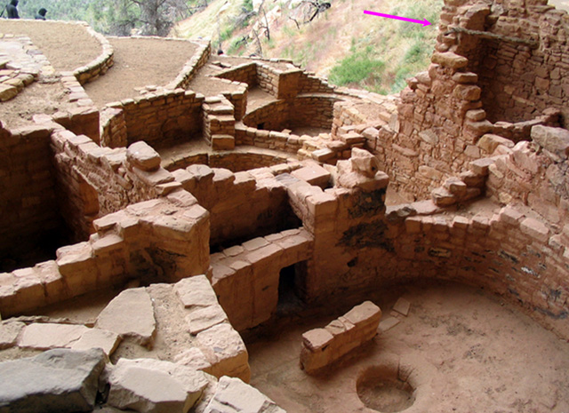 Long House cliff dwellings at Mesa Verde National Park.  Most of the construction material is stone but a single log is shown.