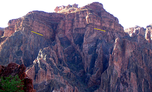 a rock formation in the Canyon shows dark rock (metamorphosed) on the bottom and sedimentary rocks on top.