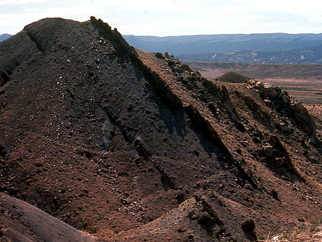 an outcropping of rock called the Morison Formation shows tipped up layers.
