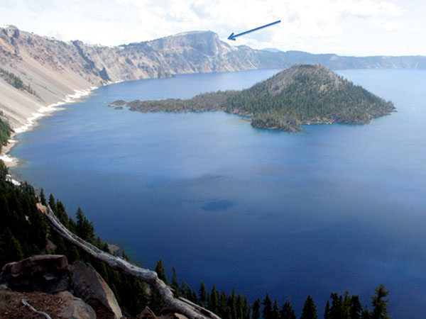 Crater lake with Wizard Island in the middle of it