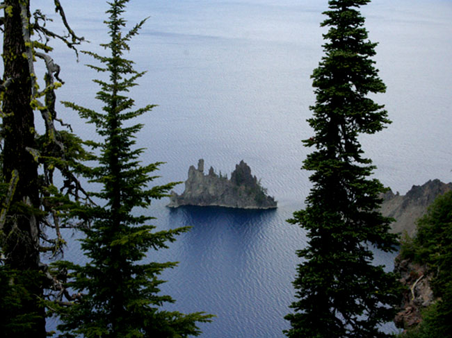 rocks jutting up out of Crater lake. Looks like a pirate ship