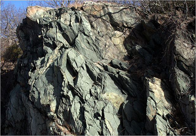 a large outcropping of greenish rock called greenstone