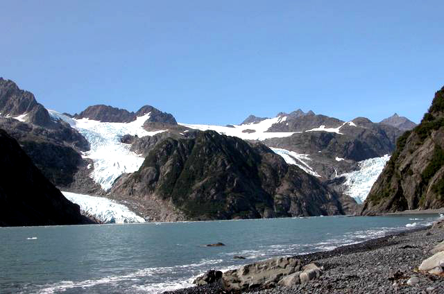 Holgate, AK, 2004. Small amount of glacier visible, large portions of rock exposed, water in foreground.