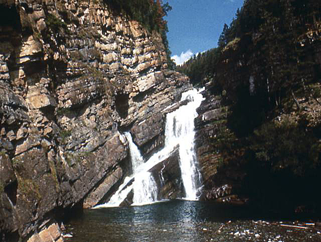 Comeron Falls, Waterton Lakes, Alberta, Canada.  Water falls from different heights and at different angles.