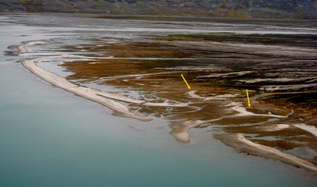 A braided river has wave-formed beaches near the sea; a recent storm moved some beaches well inland.