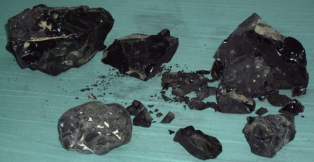 Bitumen, black and shiny lumps