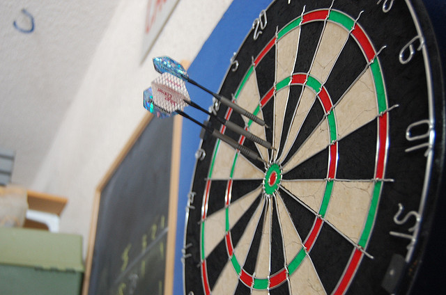 Photograph of darts on a dartboard