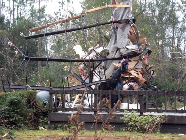 Photograph of EF-3 tornado damage to a mobile home.