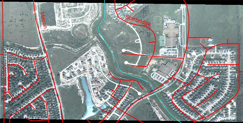 Mismatch between TIGER street data (red lines) and actual aerial image. close but not quite a right fit