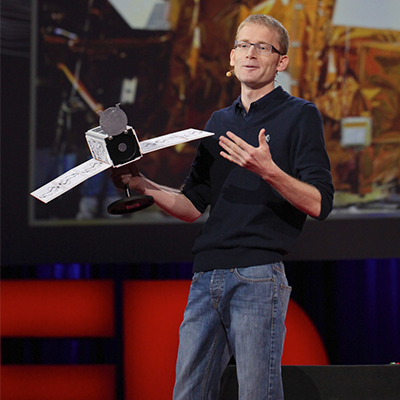 Will Marshall holding a nanosatellite